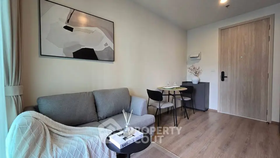 Modern living room with cozy sofa and dining area in stylish apartment