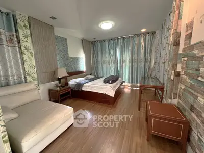 Spacious bedroom with elegant decor and natural light