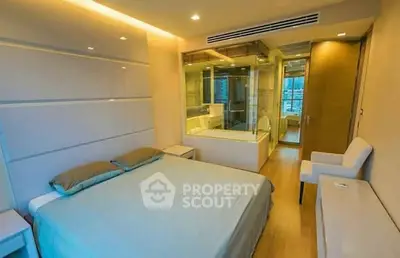 Luxurious modern bedroom with ensuite bathroom and elegant lighting