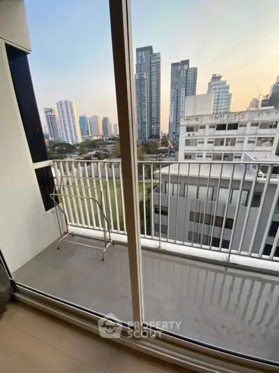 Modern balcony with city skyline view, perfect for urban living.