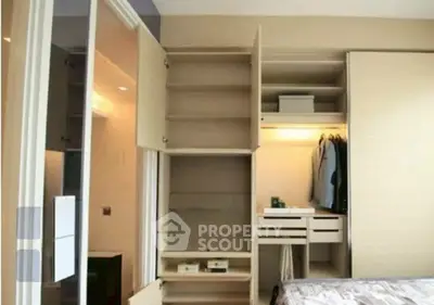 Spacious bedroom with built-in wardrobe and modern design, perfect for organized living.