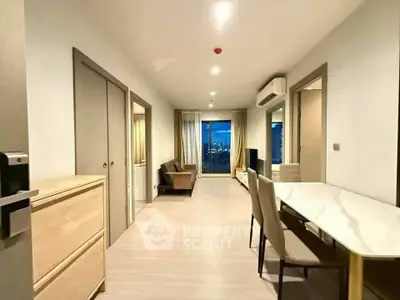 Spacious modern living room with city view, open layout, and elegant furnishings.