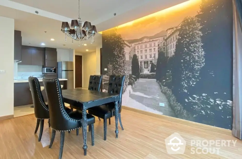 Elegant dining area with stylish black chairs and scenic wall mural in modern apartment.