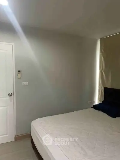 Cozy bedroom with minimalist decor and natural light