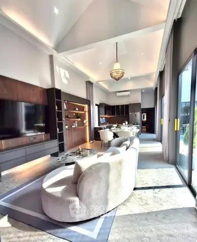 Luxurious open-plan living room with elegant chandelier and modern decor