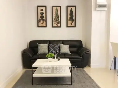 Stylish living room with black leather sofa and modern decor