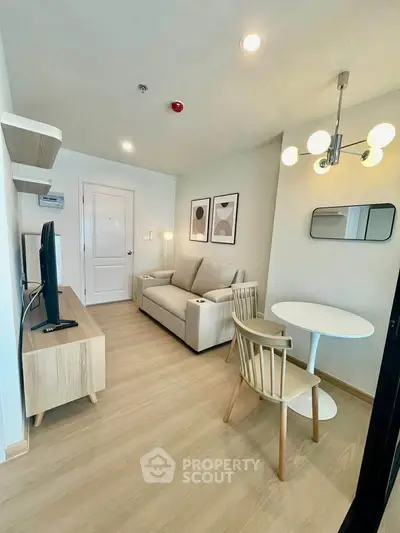 Modern living room with stylish furniture and elegant lighting in a cozy apartment.