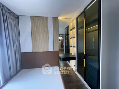 Modern bedroom with sleek built-in wardrobe and stylish wall paneling