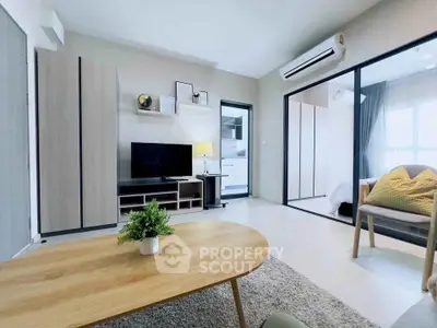 Modern living room with sleek furniture and open layout in a stylish apartment.
