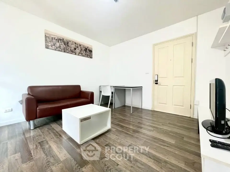 Modern living room with sleek furniture and wooden flooring