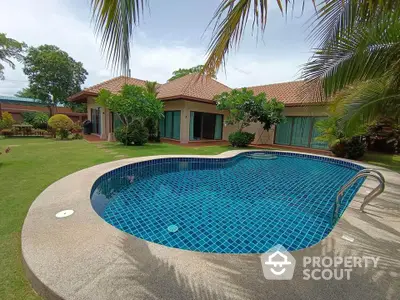 Luxurious villa with private pool and lush garden in tropical paradise setting