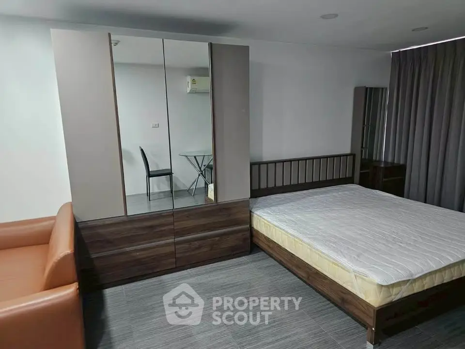 Modern bedroom with sleek furniture and natural light