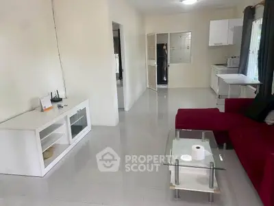 Spacious living room with modern furniture and open kitchen layout