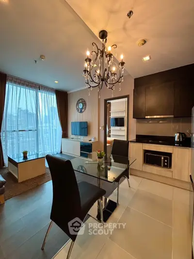 Modern living room with elegant chandelier and city view