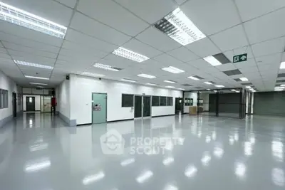 Spacious industrial warehouse with polished floors and modern lighting