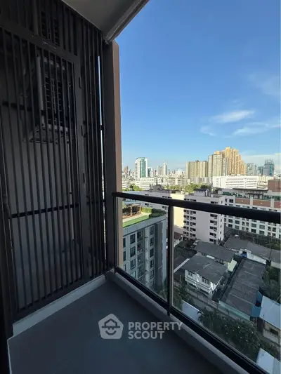 Modern balcony with city skyline view, perfect for urban living enthusiasts.