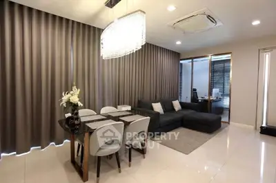 Modern living room with elegant dining area and stylish decor