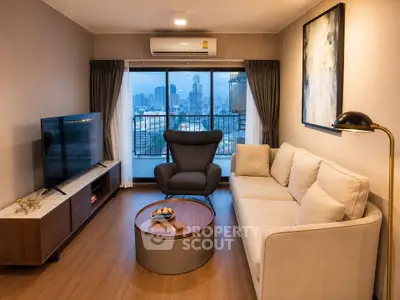 Modern living room with city view, stylish furniture, and large windows for natural light.