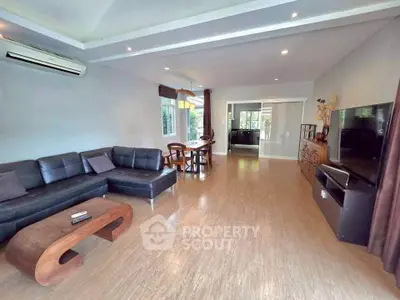 Spacious modern living room with sleek furniture and open layout