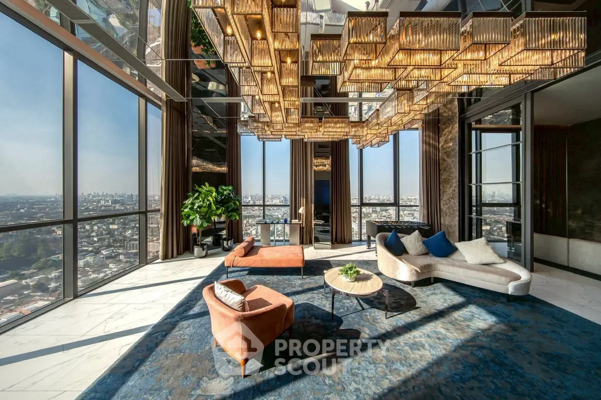 Luxurious high-rise living room with panoramic city views and elegant modern decor.