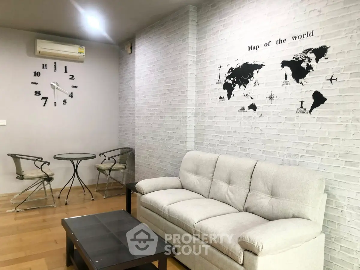 Modern living room with world map wall art and stylish furniture