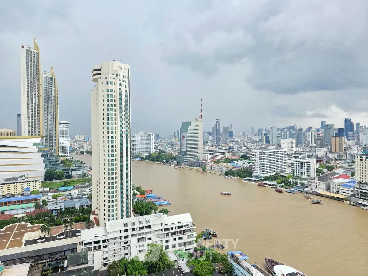 Stunning cityscape view with river and skyscrapers, perfect for urban living enthusiasts.