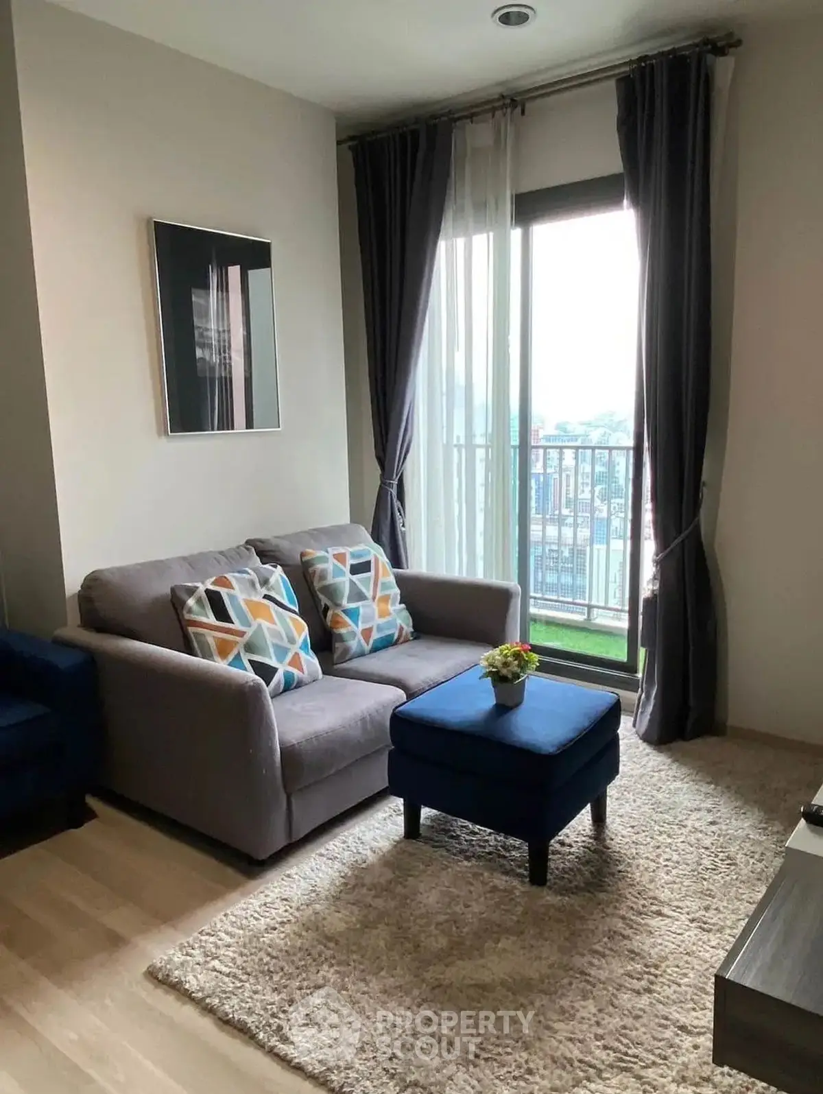 Cozy living room with modern decor and balcony view