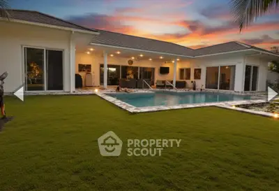 Luxurious modern home with stunning pool and lush garden at sunset, perfect for relaxation and entertainment.