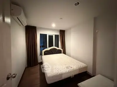 Cozy bedroom with modern design, featuring a comfortable bed and ambient lighting for a relaxing atmosphere.