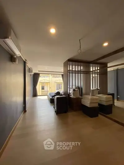 Spacious modern living room with large windows and sleek design