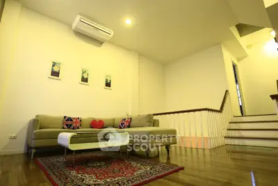 Spacious living room with modern decor and cozy seating area