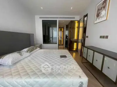 Modern bedroom with stylish decor and ample natural light