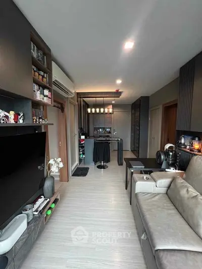 Modern living room with open kitchen layout and stylish decor