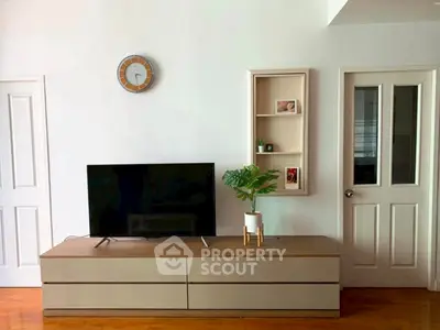 Modern living room with sleek TV stand and wall decor