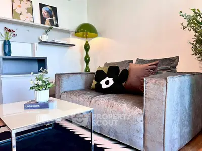 Stylish living room with modern decor, plush sofa, and chic coffee table, perfect for urban living.