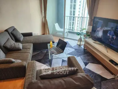 Modern living room with stylish furniture and balcony view