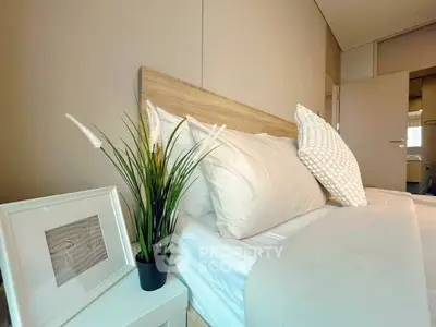 Cozy modern bedroom with stylish decor and neutral tones