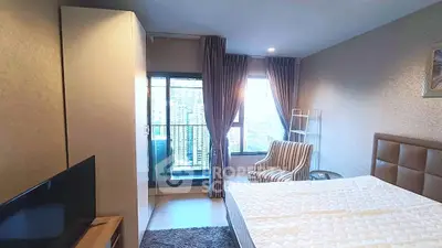 Modern bedroom with balcony view in high-rise apartment