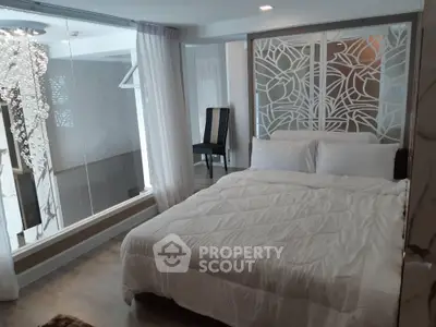 Luxurious modern bedroom with elegant decor and large glass window