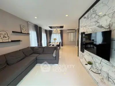 Modern living room with elegant decor and wall-mounted TV