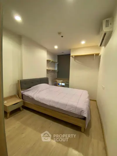Cozy bedroom with modern furnishings and soft lighting, perfect for relaxation and comfort.