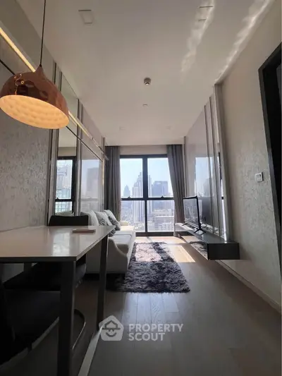 Modern living room with city view, sleek furniture, and natural light.