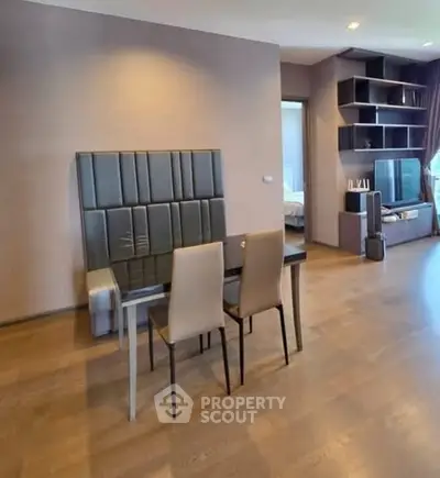 Spacious modern living room with elegant dining area and stylish shelving