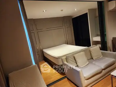 Modern studio apartment with cozy living area and stylish bedroom design