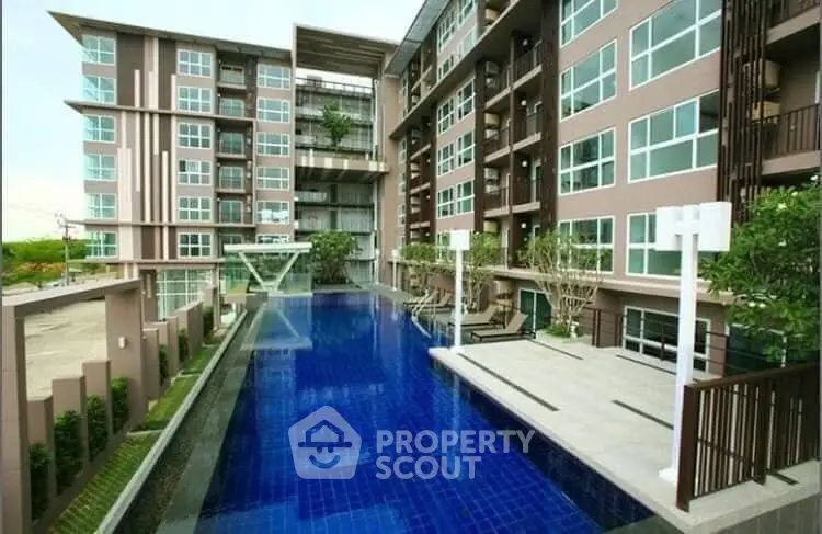 Modern condominium with luxurious pool and stylish architecture