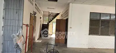 Spacious industrial-style interior with exposed brick and metal accents