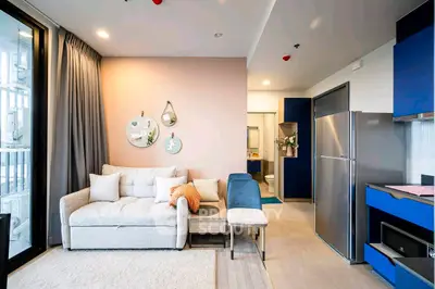 Modern living room with stylish decor and open kitchen layout