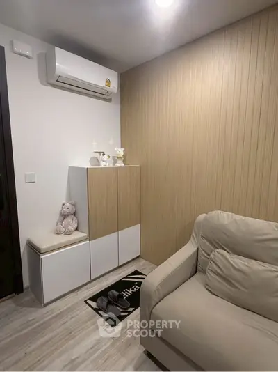 Cozy living room with modern decor and air conditioning