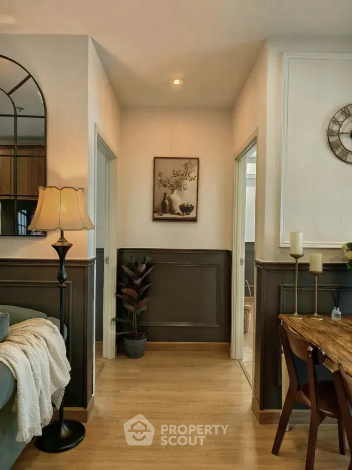 Charming interior hallway with elegant decor and warm lighting in a cozy home setting.