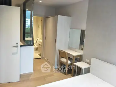 Modern bedroom with ensuite bathroom and minimalist furniture design